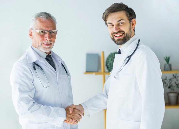 doctors shaking hands looking camera 23 2147896205