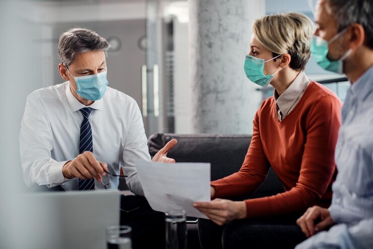 financial advisor couple wearing face masks while talking office 637285 11100